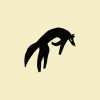 Wolf silhouette rubber stamp on pale yellow background.