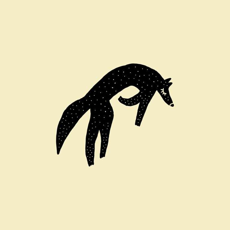 Wolf silhouette rubber stamp on pale yellow background.