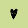 Rubber stamp with a black heart illustration on a green background.