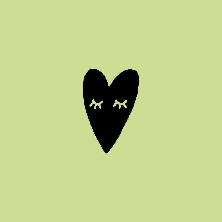 Rubber stamp with a black heart illustration on a green background.