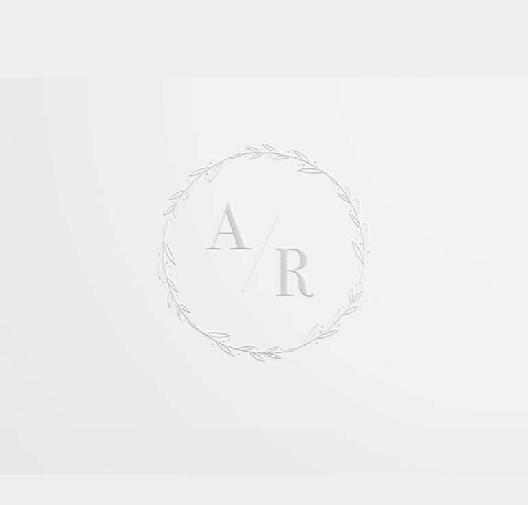 Simple wedding embosser with initials embossed in white.