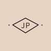 Diamond-shaped clay stamp impression with initials “JP”.