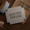 Expressionery custom logo rocker stamp used on kraft packaging box.