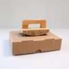 Expressionery rocker logo rubber stamp on cardboard packaging.