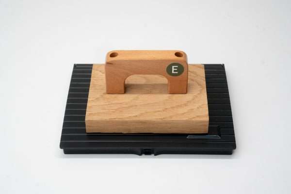 Overhead view of Expressionery large wooden rubber stamp and ink pad.