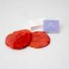 Expressionery playdough rubber stamp with red playdough impression.
