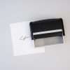 Trodat 4916 self-inking signature stamp with rectangular print area.