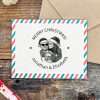 Custom portrait Christmas rubber stamp on festive envelope.