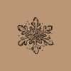 Decorative snowflake Christmas stamp design printed on warm brown background.