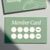Green embossed loyalty card mockup with stamp impressions.